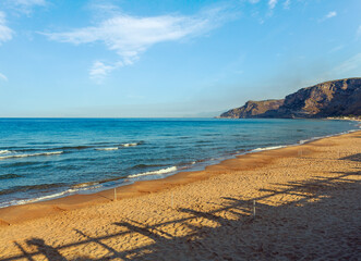 Morning shadows on beautiful Tyrrhenian sea sandy beach (Gaeta, Latina, Italy)