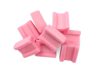 Tasty pink chewing gums on white background, top view