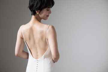 Asian women's beautiful backs and shoulder blades. Figure of a looking back beauty looking back....