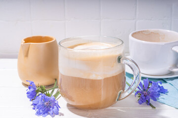  Chicory herbal coffee latte, cappuccino drink, with whipped non-dairy milk and blue flowers on...