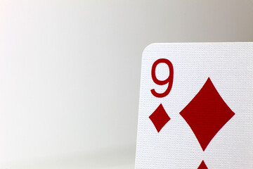 9 of Diamonds, close up of corner of playing card