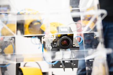 Machine vision. The manipulator arm uses a camera to observe and control objects in stock.
