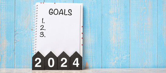 2024 Happy New Year with GOAL word and wooden number. time for a New Start, Resolution, Plan,...
