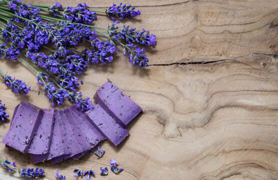 lavender cheese with flowers on wooden background 