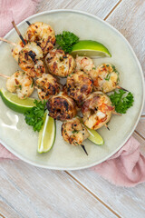 Grilled shrimp skewers. Seafood, shelfish. Shrimps Prawns skewers with lime. Barbecue srimps prawns.