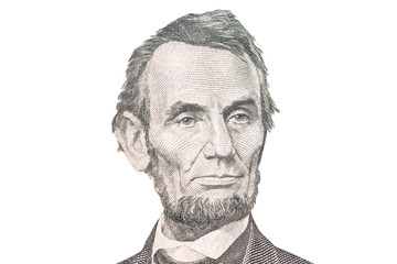 Portrait of US president Abraham Lincoln. Face Lincoln on USA 5 dollar bill closeup isolated....