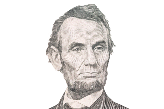 Portrait of US president Abraham Lincoln. Face Lincoln on USA 5 dollar bill closeup isolated. America money
