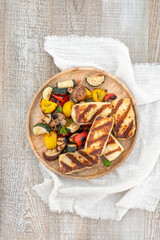 Grilled colorful vegetable : bell pepper, zucchini, eggplant with halluomi cheese on a plate