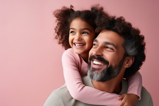 Portrait of happy african american father and daughter on pink background. Ai generated.