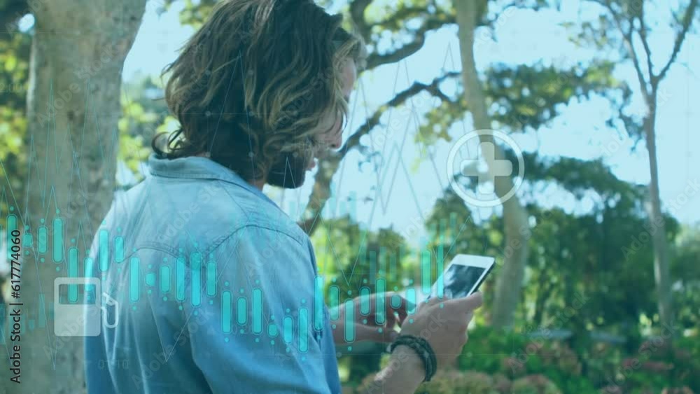 Aufkleber animation of digital icons and data processing against caucasian man using digital tablet at a park