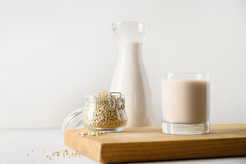 Alternative plant based green buckwheat milk in glass. Vegan milk replacer and lactose free. Copy space.