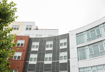 modern building in the heart of the financial district, symbolizing progress and prosperity in the commercial real estate industry. Its large windows represent transparency and sleek design