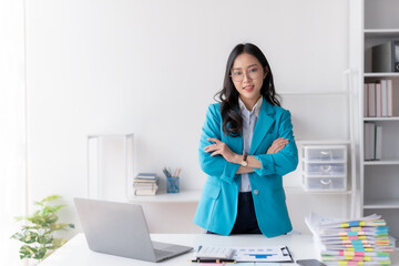 Confident Asian Businesswoman Standing in Office, Looking at Camera with Professional Demeanor....