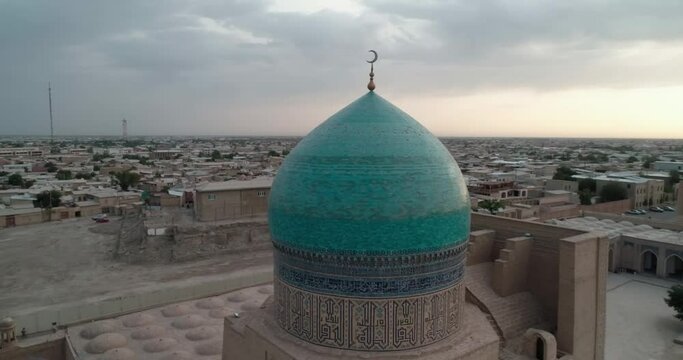 A drone flies around the Mir I Arab Madressa famous memorial complex in Bukhara at dawn