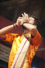 Ganga Aarti - Priest blowing the conch shell