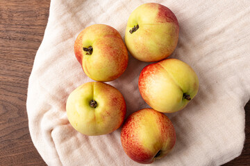 Small, sweet, hairless white peaches