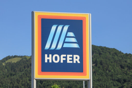 Close up of a Hofer company sign with blue sky in background, Tirol, June 2 2023