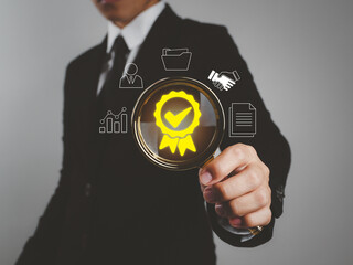 businessman holding a magnifying glass ISO standard quality control in business, impartiality in...