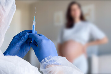 Pregnant Vaccination. Pregnant Woman Getting Vaccinated in Clinic. Doctor Giving Corona Virus...