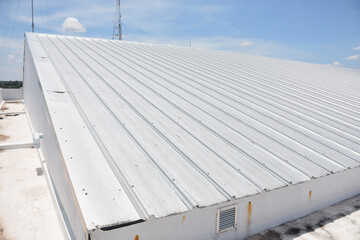 metal sheet roofing on commercial construction with blue sky