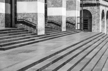 Foto op Canvas Geometric abstraction consisting of repeating steps, railings and columns.Black and white photo © annaleish