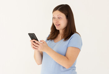 Fototapeta premium Portrait of attractive focused cheerful pregnant girl using device app chatting isolated over white color background