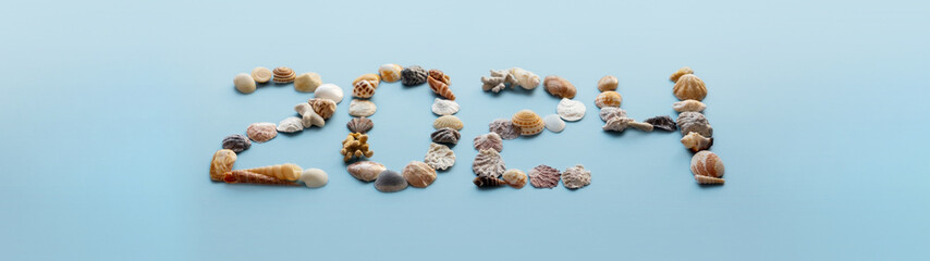 2024 made by seashells. New year holidays in tropics.