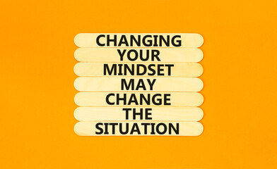 Changing mindset symbol. Concept words Changing your mindset may change the situation on wooden stick on a beautiful orange table orange background. Business motivational Changing mindset concept.