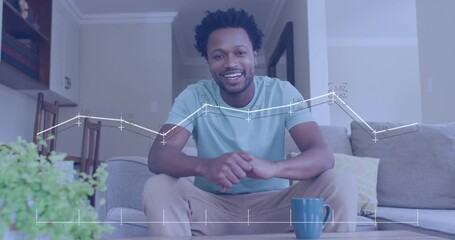 Animation of data processing over african american man smiling and talking looking at the camera - Powered by Adobe