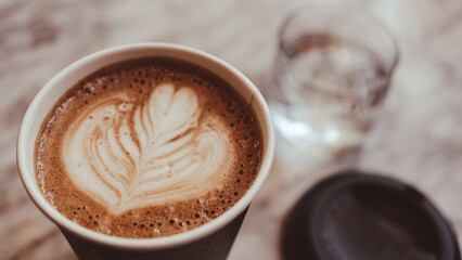 Hot coffee mocha in simple black paper cups.