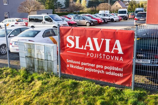 Banner of Slavia Pojistovna insurance  company at car service garage to handle traffic accidents