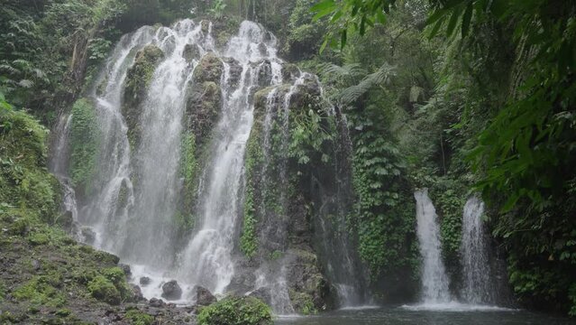 Banyu Wana Amertha Waterfall Surrounded by Lush Tropical Vegetation in Bali, Indonesia