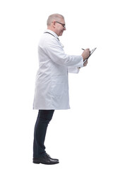 in full growth. a smiling doctor taking notes on his tablet