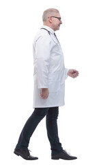 side view. smiling doctor walking to help.