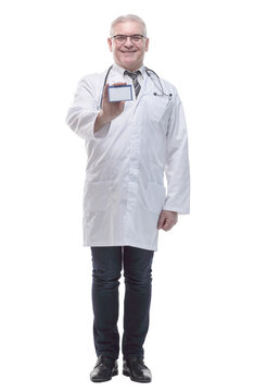 in full growth. qualified doctor showing his visiting card