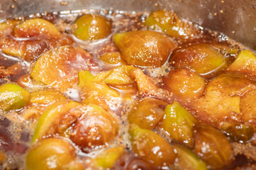 A pot filled with fruit for use in baking.