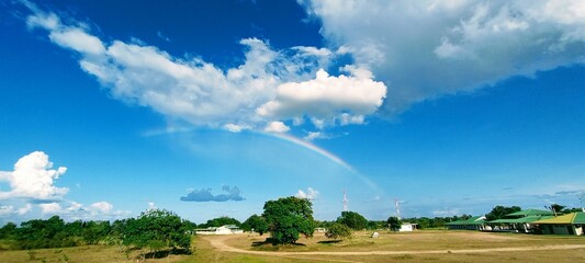 beautiful rainbow in a blue sky
