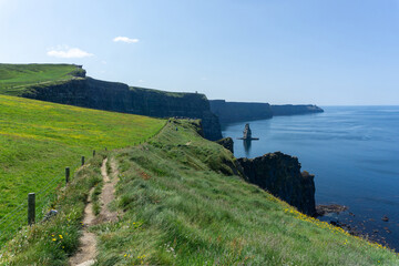 Panoramic view of Cliffs of Moher on a sunny day in Burren, Ireland