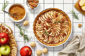 Apple pie. Apple tart with cinnamon, walnuts and pecan nuts, top view