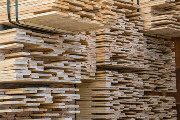 Close up of stacks of lumber being stored in a warehouse