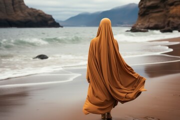 Woman wearing a hijab walking on the beach alone , backview. Generative AI