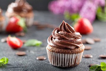 Chocolate cupcakes. Freshly baked muffins with fresh berries