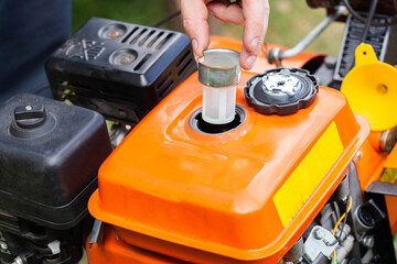 Replacing the fuel filter in the gas tank of the walk-behind tractor. Maintenance of technology. Industry