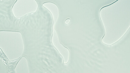 abstract fresh flowing water texture with sunlight, transparent cosmetic fluid background concept for moisturizer, liquid lotion or pharmacy products