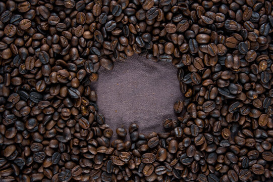 Roasted coffee beans background with free space for ideas.