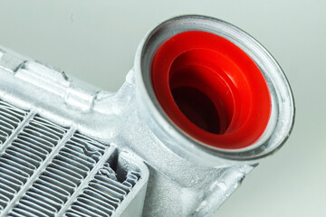 New car radiator car stove on a white background, close-up