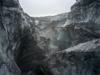 By the entrance of Katla Ice Cave, Mýrdalsjökull Glacier, South Iceland.