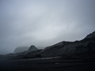Fototapeta premium Mýrdalsjökull Glacier covered in sand and dark soil. By the entrance of Katla Ice Cave. South Iceland.