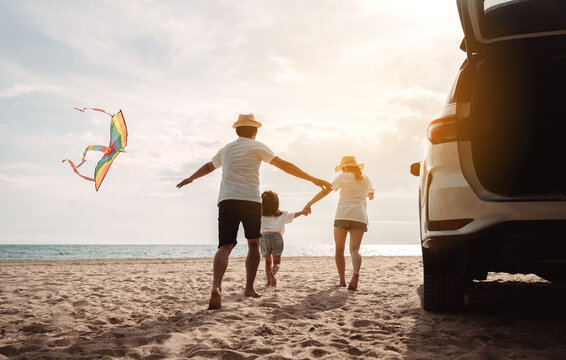 Family happy traveling enjoy in vacation with Car travel driving road trip summer vacation in car in the sunset, Dad, mom and daughter  holidays and relaxation together get the atmosphere.