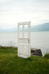 White door next to a lake door to heaven